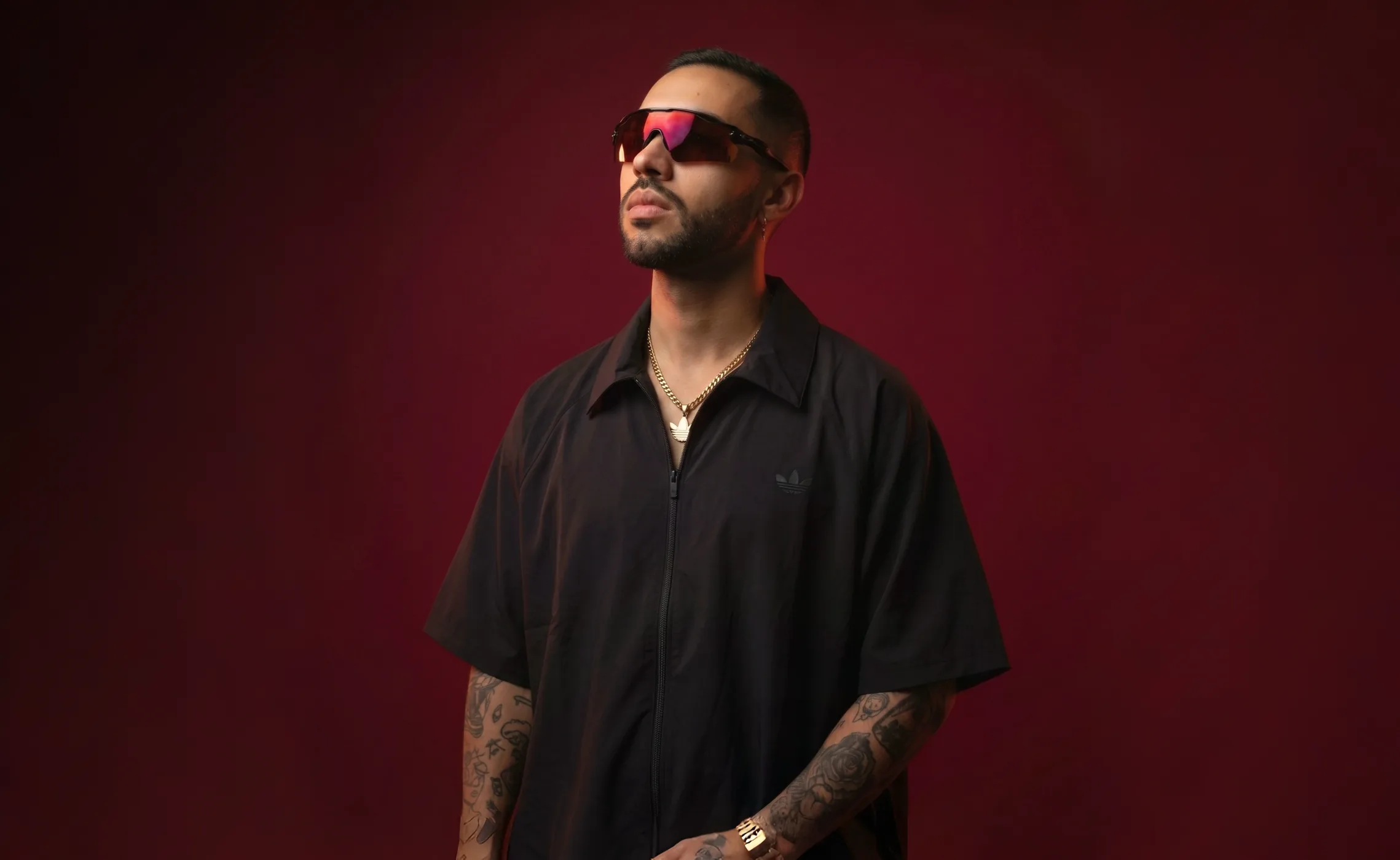 Jiffy Trice against a red studio background